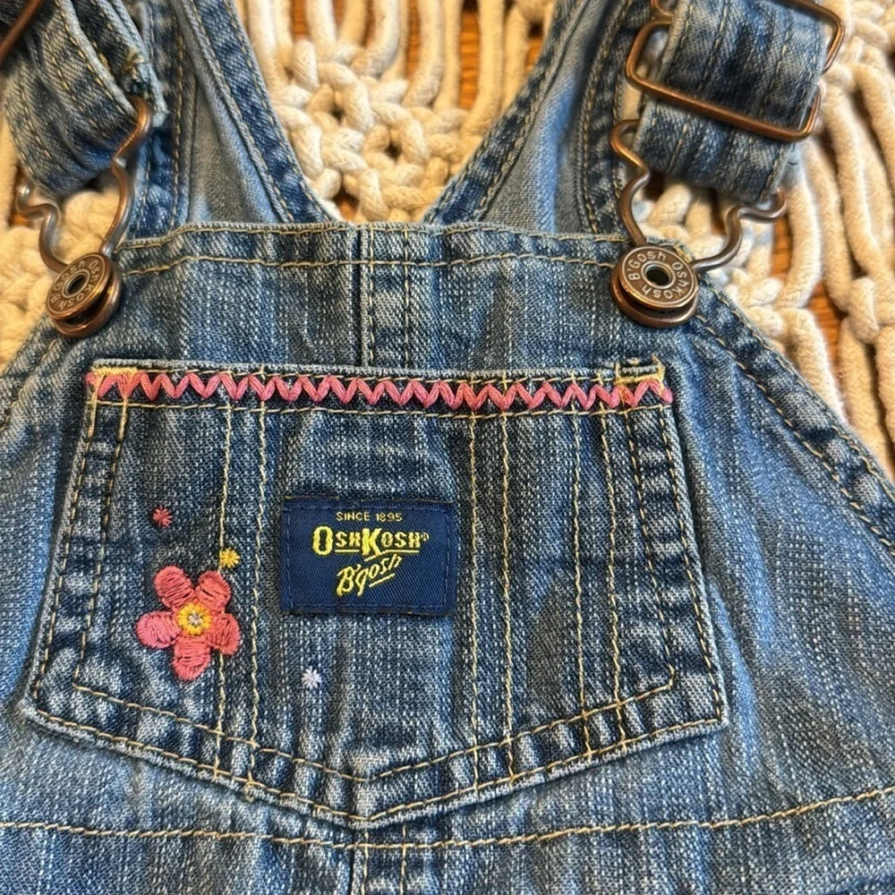 OshKosh B'gosh Blue Denim bib Overalls Embroidered pink flowers‎ size 6/9 months